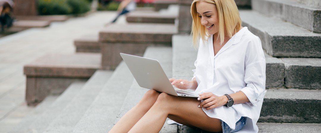 young-woman-using-laptop-computer-smart-phone-beautiful-student-girl-working-laptop-outdoor.jpg